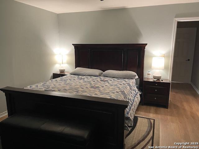 400 North Chaparral Burnet, TX 78611 - Photo 9 of 24 a bedroom with a bed and a dresser