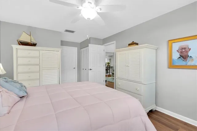 a bedroom with a bed and a closet