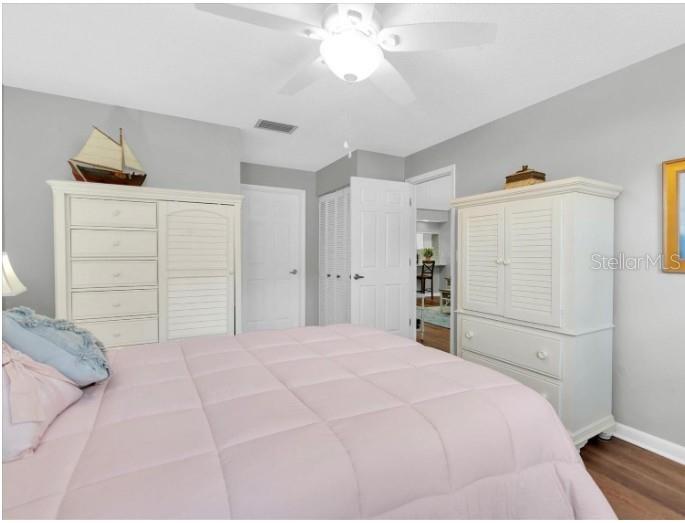 9312 Golf View Drive, Unit 3 New Port Richey, FL 34655 - Photo 17 of 32 a bedroom with a bed and a closet