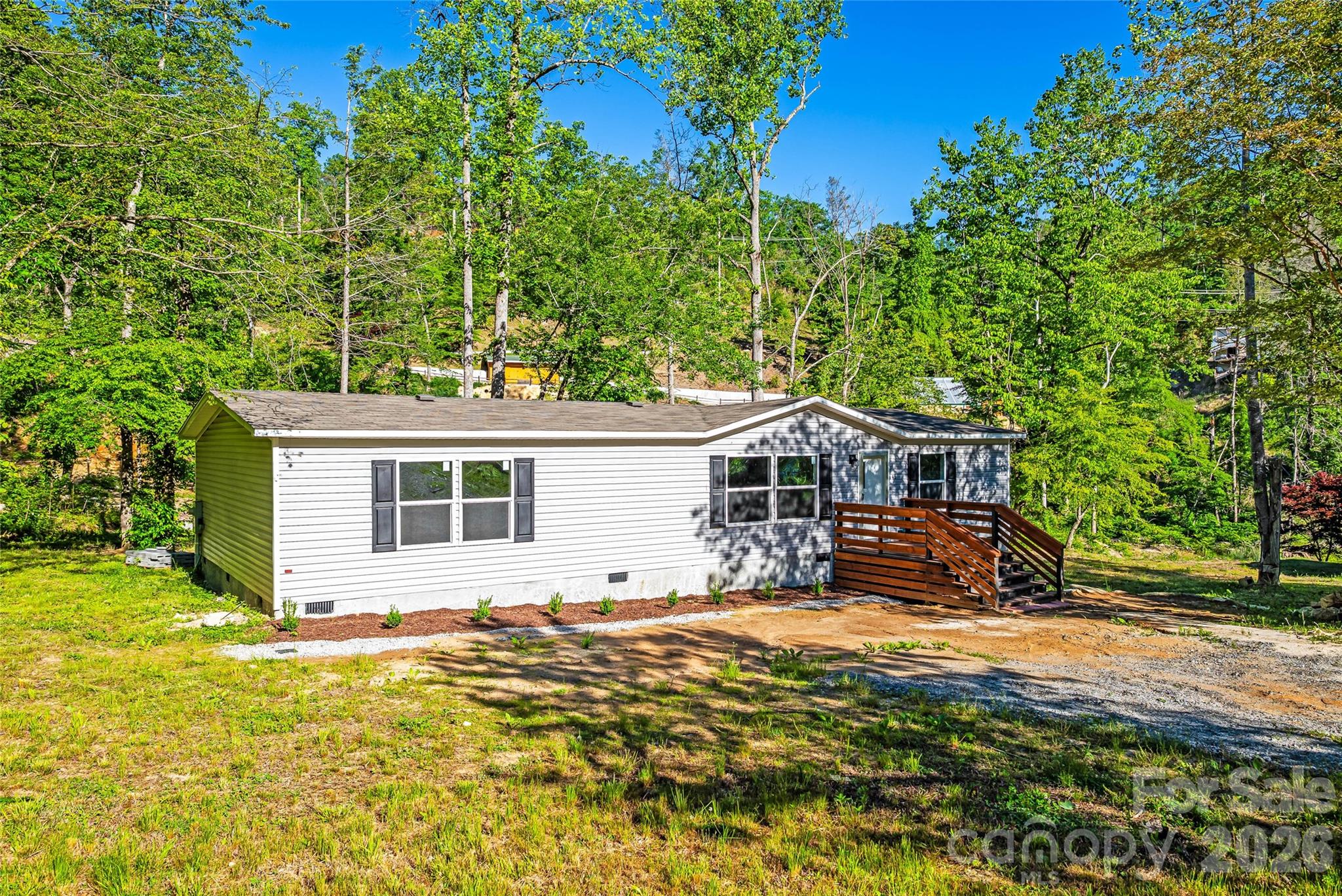 45 Alan Retreat Road Hendersonville, NC 28792 - Photo 1 of 25 a view of a house with a yard