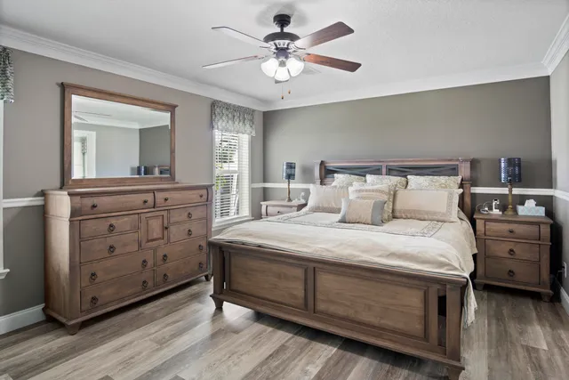 a bedroom with a bed and a dresser