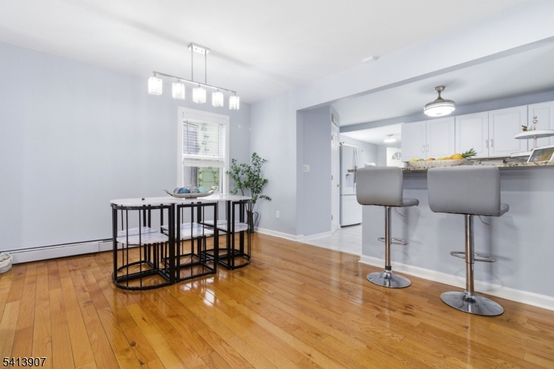 32 Cedar Avenue Elizabeth, NJ 07202 - Photo 7 of 32 a view of a dining room with furniture window and wooden floor