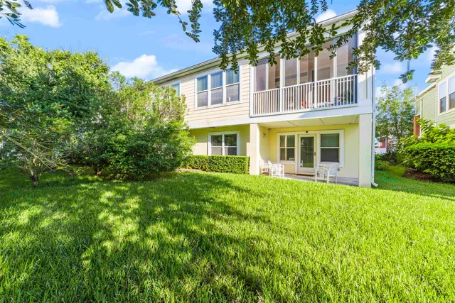 a view of a dining room with furniture wooden floor and chandelier
