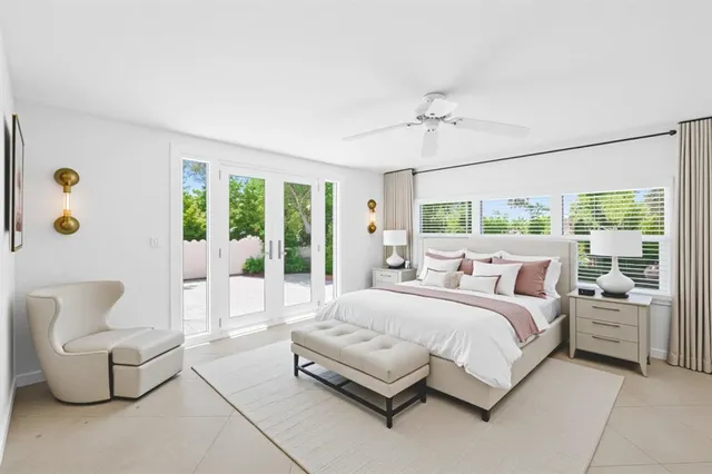 a bedroom with a bed couch and window