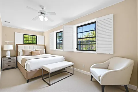 a bedroom with a bed and a couch