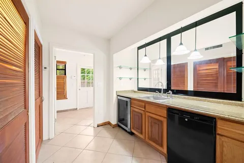 a large bathroom with a large tub and sink