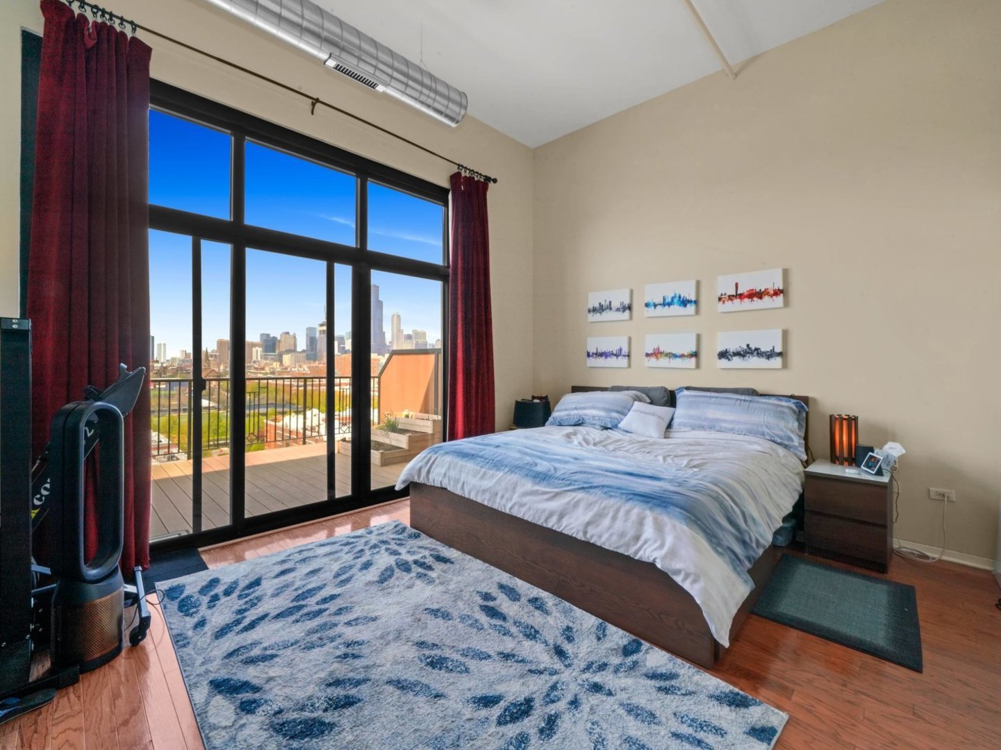 1525 South Sangamon Street, Unit 802P Chicago, IL 60608 - Photo 12 of 32 a bedroom with a large bed and a large window