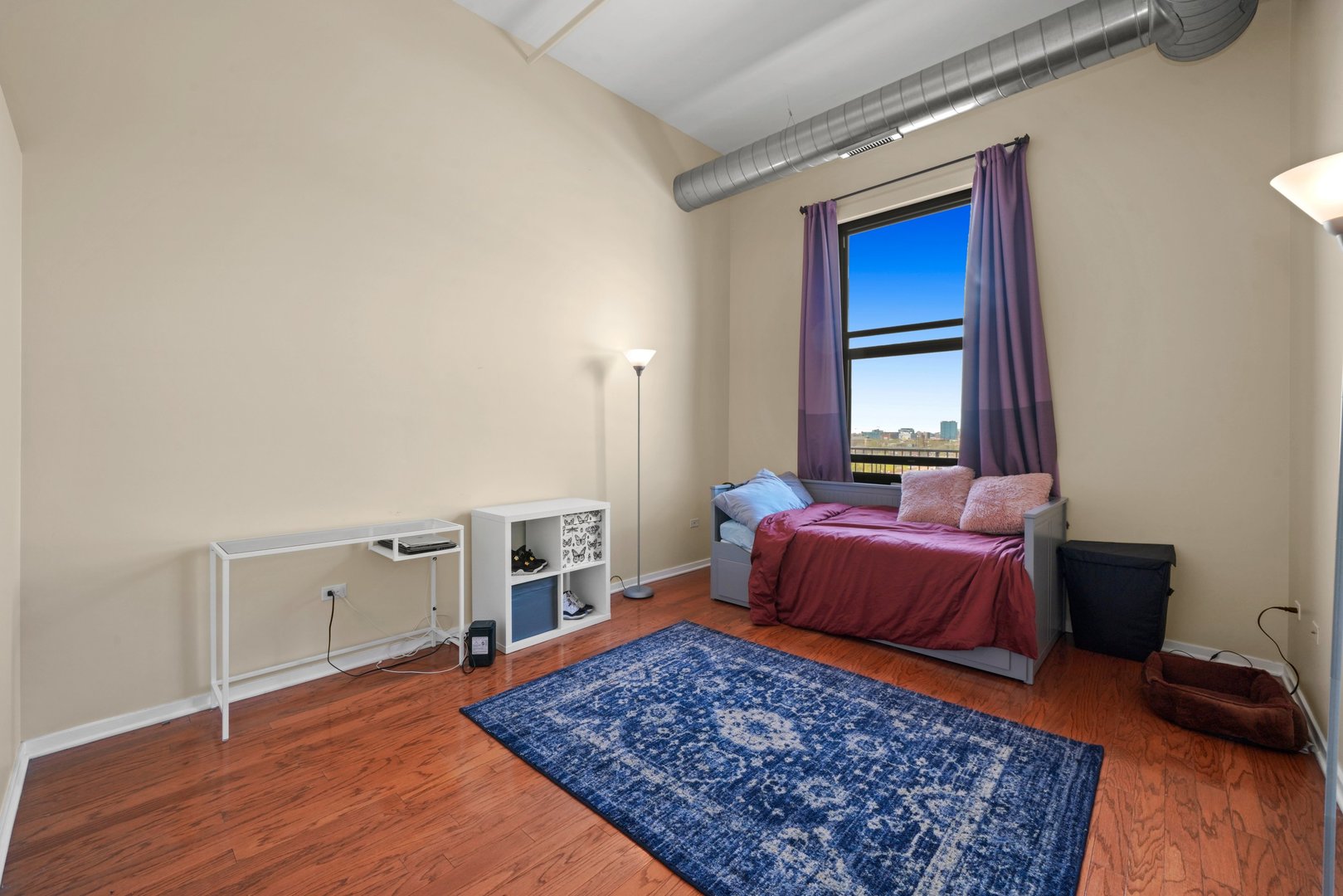 1525 South Sangamon Street, Unit 802P Chicago, IL 60608 - Photo 17 of 32 a living room with furniture rug and a table