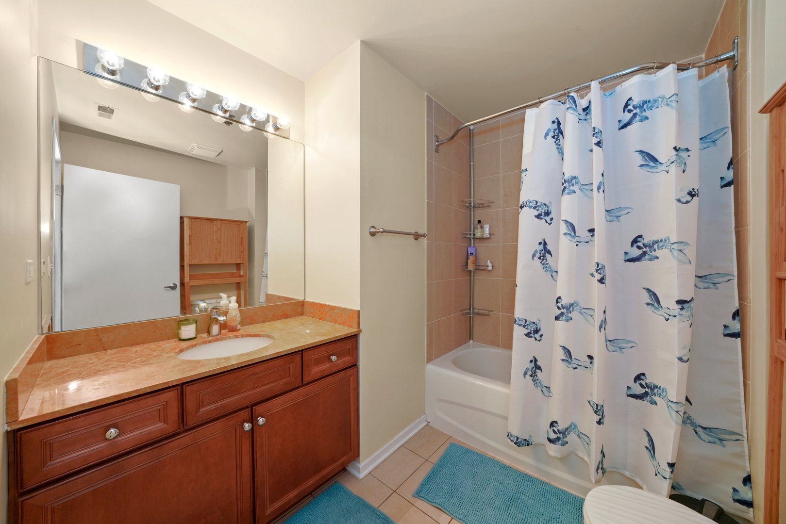 1525 South Sangamon Street, Unit 802P Chicago, IL 60608 - Photo 18 of 32 a bathroom with a sink double vanity and a mirror
