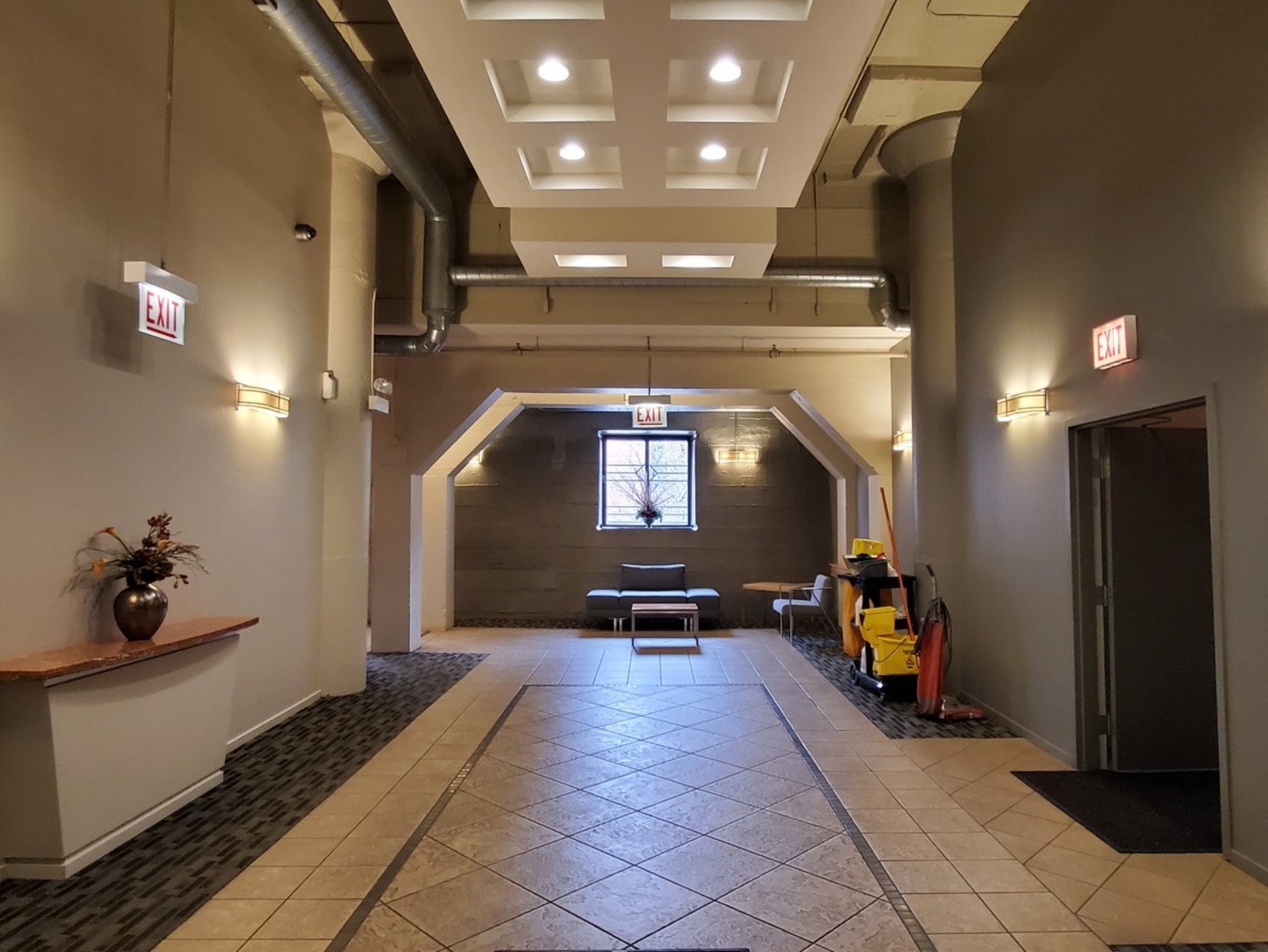 1525 South Sangamon Street, Unit 802P Chicago, IL 60608 - Photo 29 of 32 a lobby with furniture and a chandelier