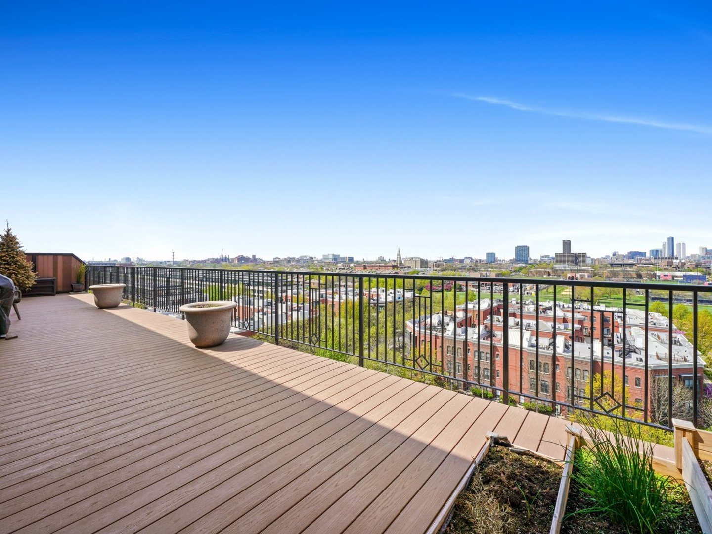 1525 South Sangamon Street, Unit 802P Chicago, IL 60608 - Photo 8 of 32 a view of balcony with wooden floor and ocean view