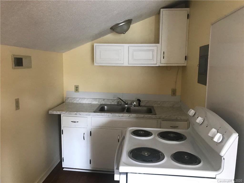 116 Walnut Street, Unit A Monroe, NC 28110 - Photo 3 of 5 a utility room with dryer and washer