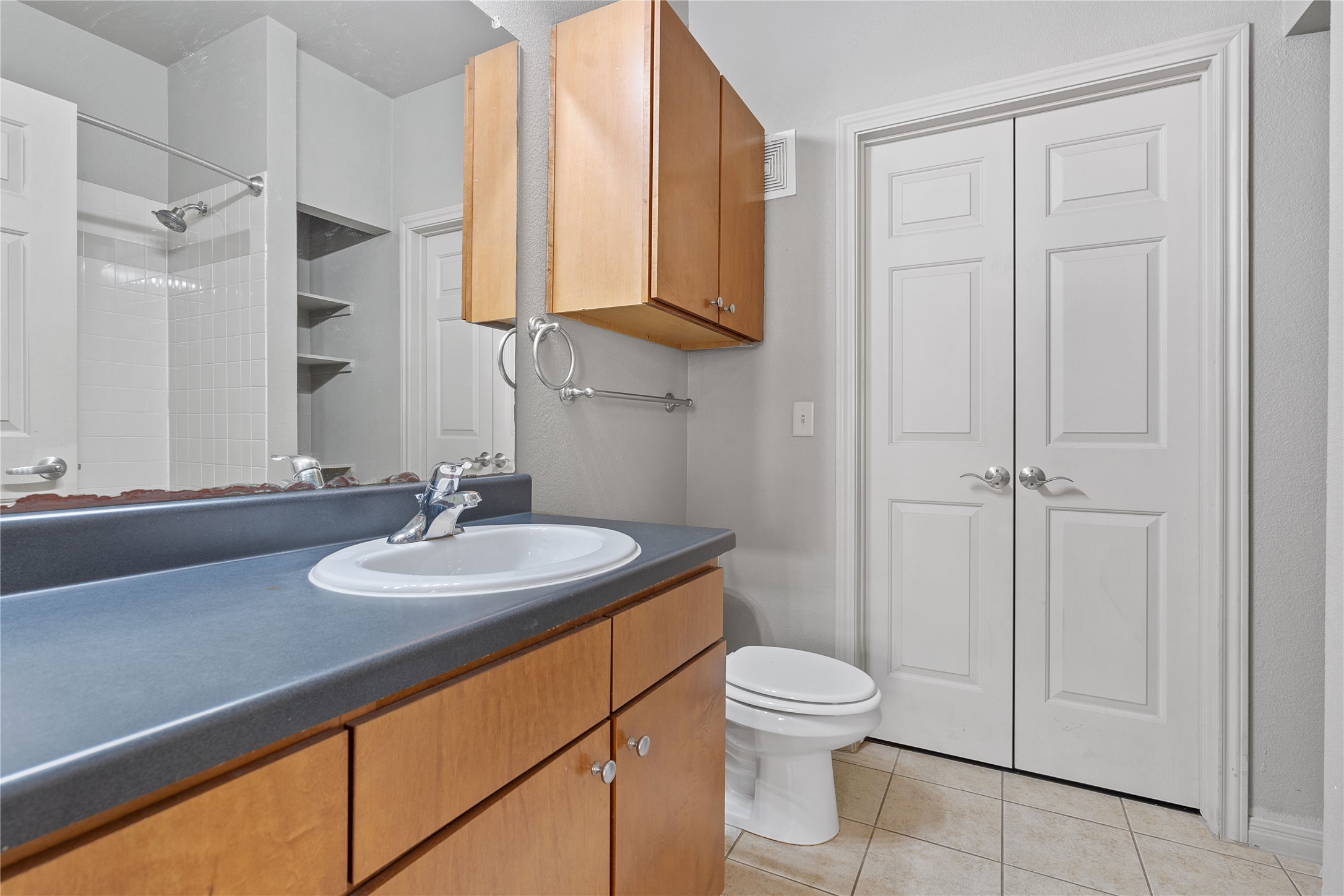 2515 Pearl Street, Unit 314 Austin, TX 78705 - Photo 4 of 17 Full bath featuring vanity and light tile patterned flooring
