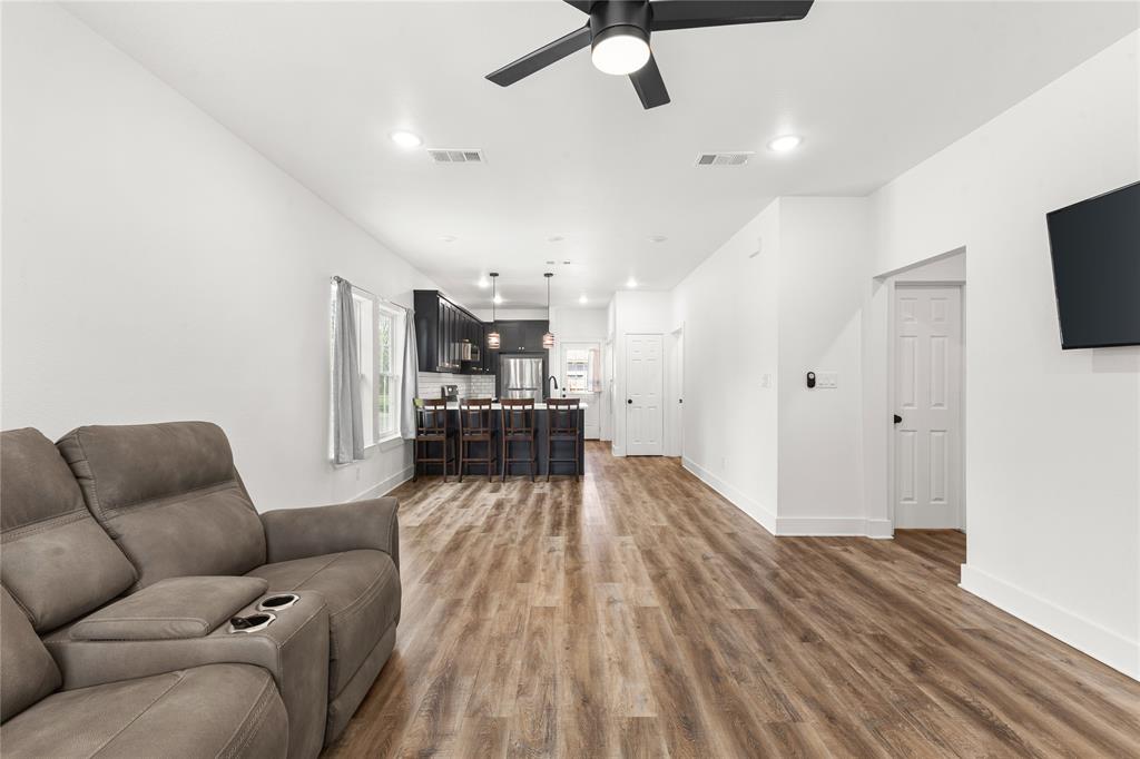 101 Ross Street Sulphur Springs, TX 75482 - Photo 4 of 30 Living area featuring light wood-style floors, ceiling fan, and recessed lighting