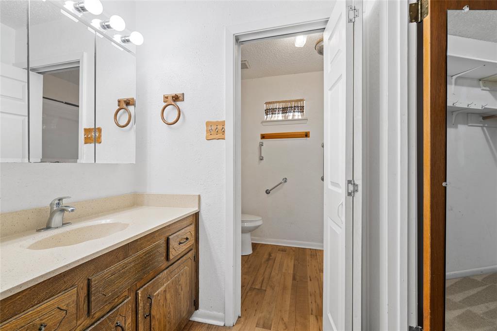 232 Monterrey Drive Hewitt, TX 76643 - Photo 12 of 27 a bathroom with a sink a vanity and a mirror
