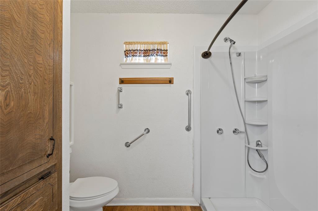 232 Monterrey Drive Hewitt, TX 76643 - Photo 13 of 27 a bathroom with a shower a toilet and sink