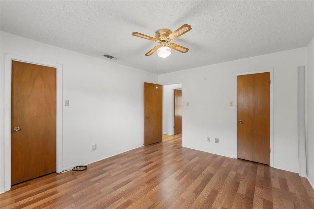 232 Monterrey Drive Hewitt, TX 76643 - Photo 16 of 27 a view of an empty room with window and wooden floor