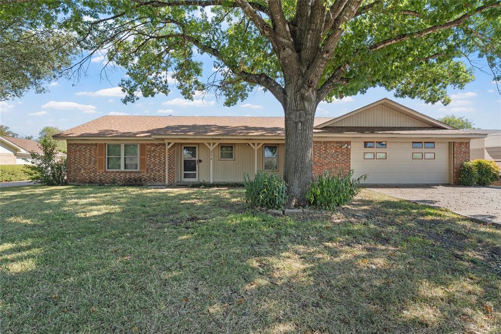232 Monterrey Drive Hewitt, TX 76643 - Photo 2 of 27 a front view of a house with a garden