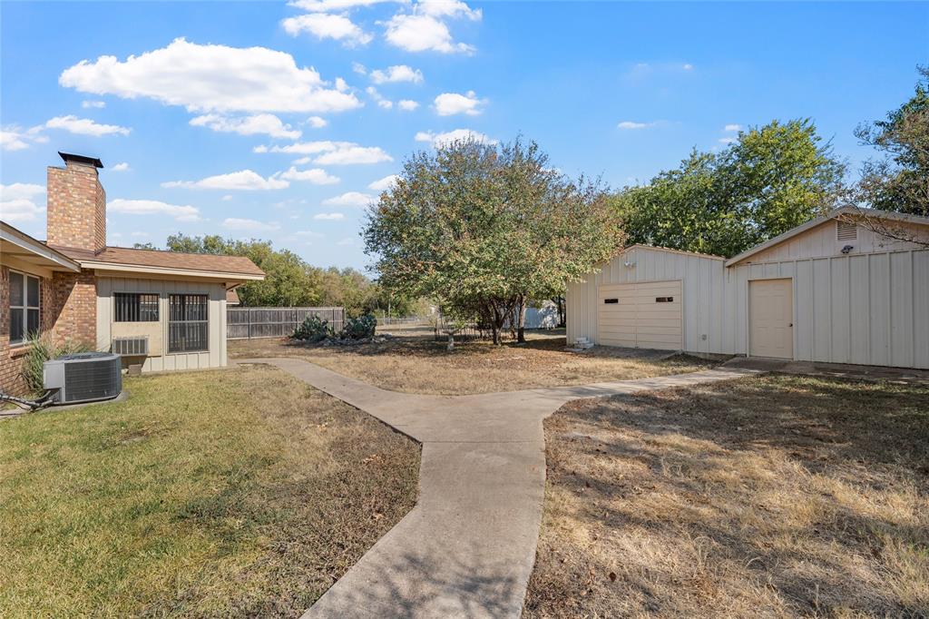 232 Monterrey Drive Hewitt, TX 76643 - Photo 25 of 27 a front view of house with a garden