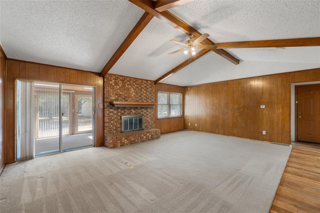 232 Monterrey Drive Hewitt, TX 76643 - Photo 4 of 27 a view of an empty room with a fireplace and windows
