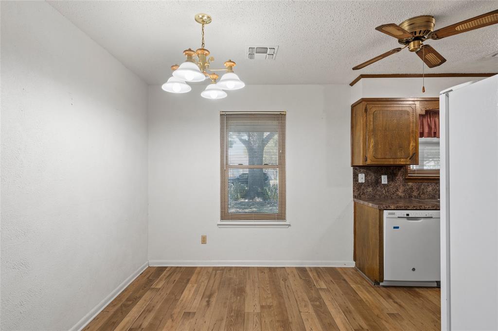 232 Monterrey Drive Hewitt, TX 76643 - Photo 7 of 27 a view of a hallway with a chandelier