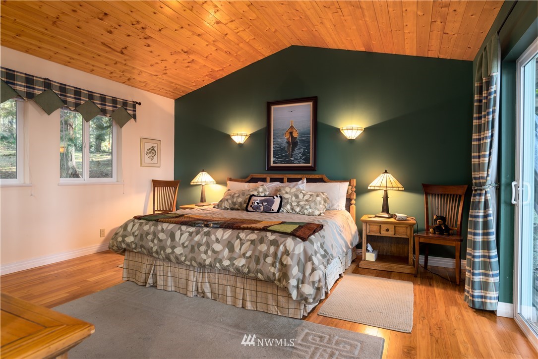 54 West Beach Path Olga, WA 98279 - Photo 12 of 39 a bedroom with a bed and a night stand