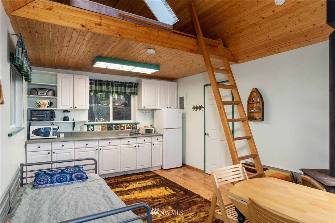 54 West Beach Path Olga, WA 98279 - Photo 23 of 39 a room with gym equipment and wooden floor