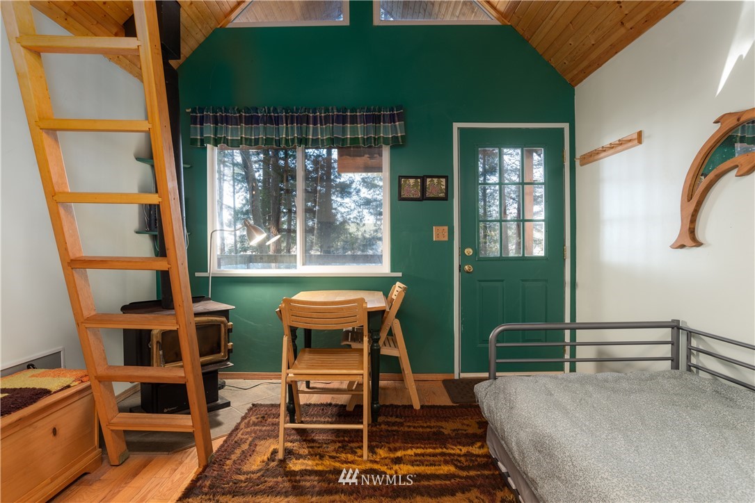 54 West Beach Path Olga, WA 98279 - Photo 24 of 39 a room with furniture and a window