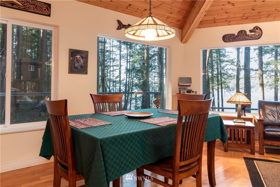 54 West Beach Path Olga, WA 98279 - Photo 5 of 39 a view of a dining room with furniture window and outside view