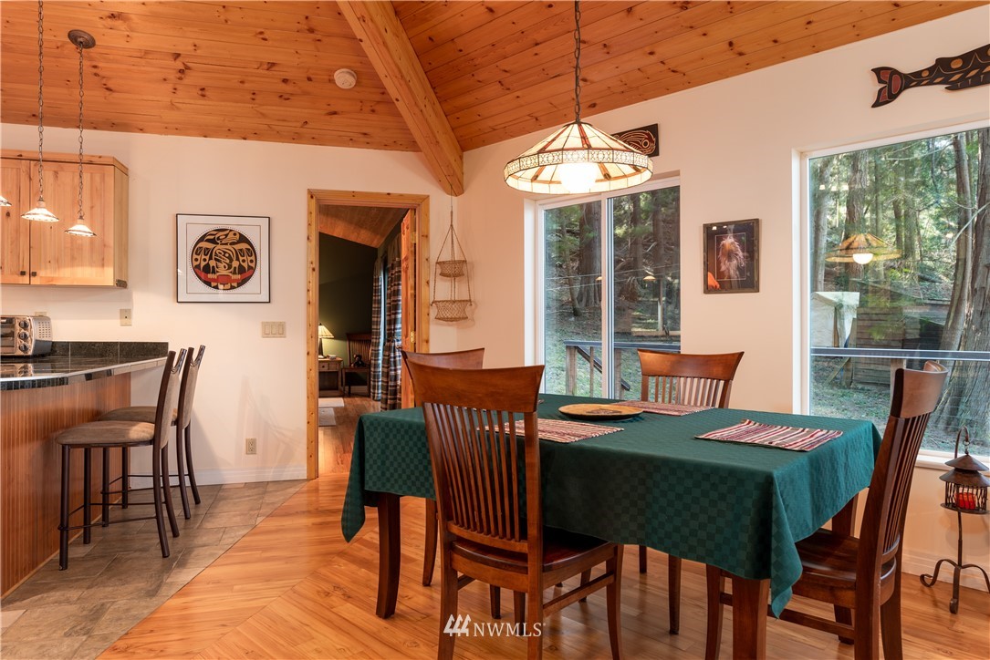 54 West Beach Path Olga, WA 98279 - Photo 6 of 39 a view of a dining room with furniture window and outside view