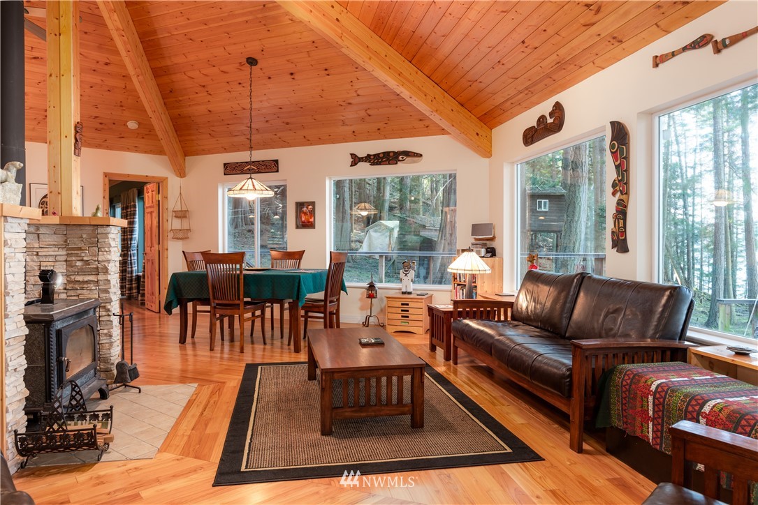 54 West Beach Path Olga, WA 98279 - Photo 8 of 39 a living room with fireplace furniture and a large window