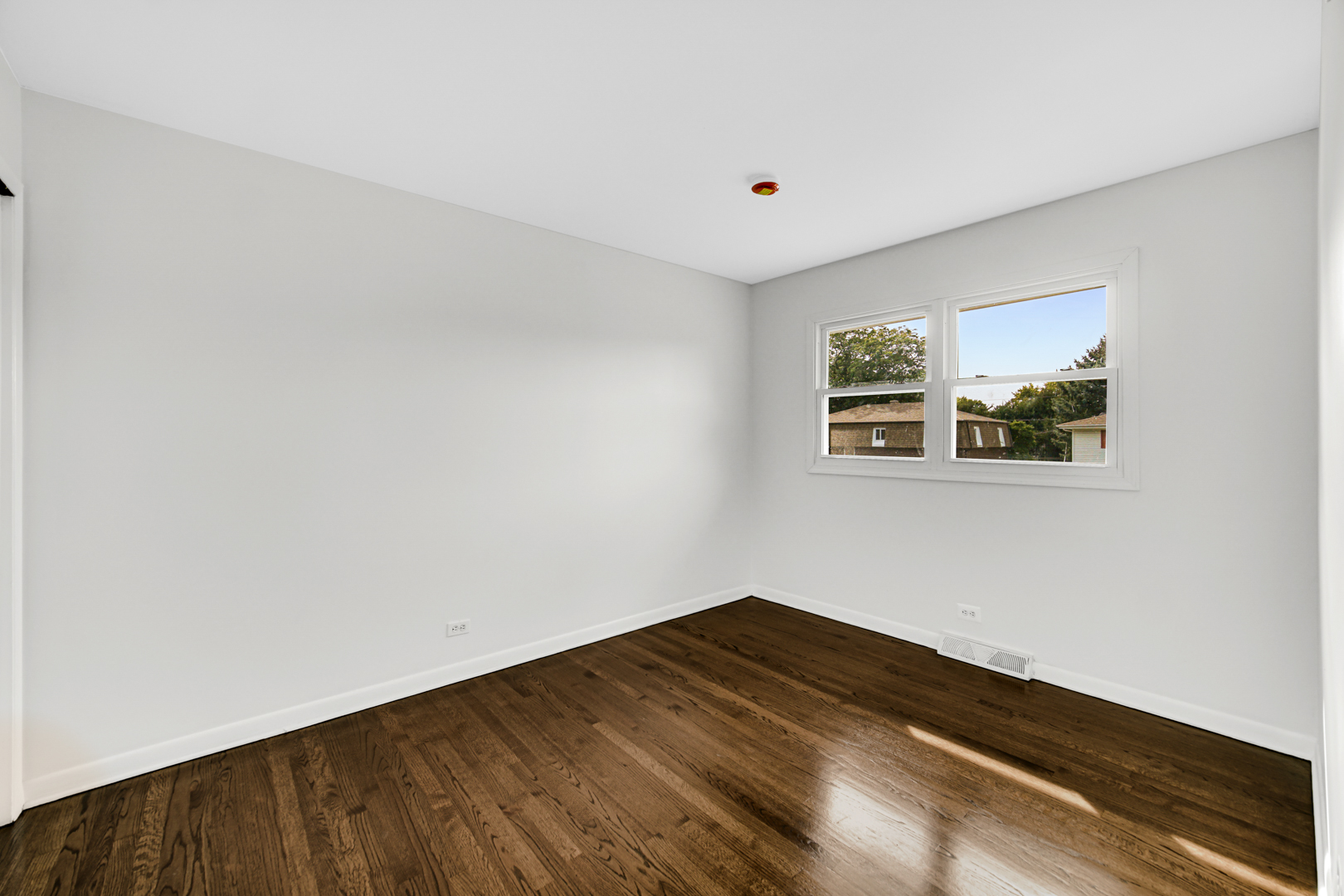214 Oakleaf Road Lake In The Hills, IL 60156 - Photo 13 of 25 a view of a room with wooden floor and white walls
