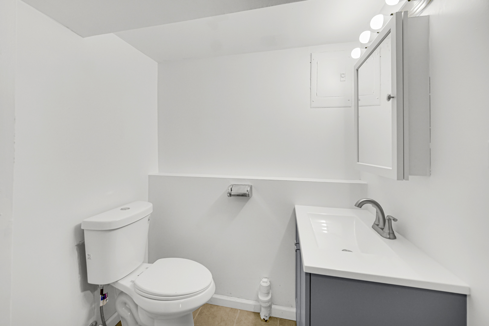 214 Oakleaf Road Lake In The Hills, IL 60156 - Photo 18 of 25 a bathroom with a sink a toilet and mirror