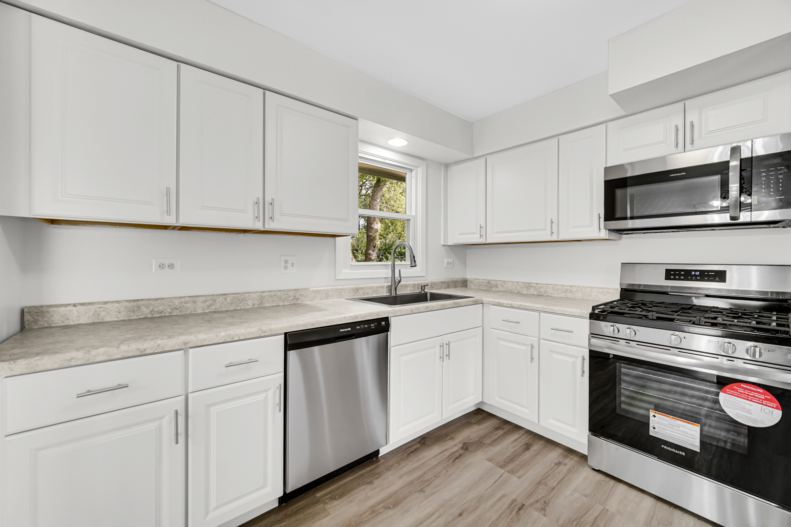 214 Oakleaf Road Lake In The Hills, IL 60156 - Photo 2 of 25 a kitchen with granite countertop cabinets stainless steel appliances and a sink