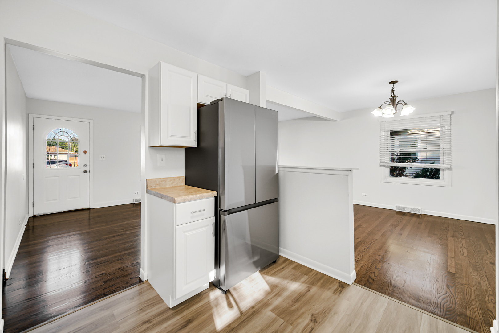 214 Oakleaf Road Lake In The Hills, IL 60156 - Photo 5 of 25 a kitchen with a refrigerator and a stove top oven
