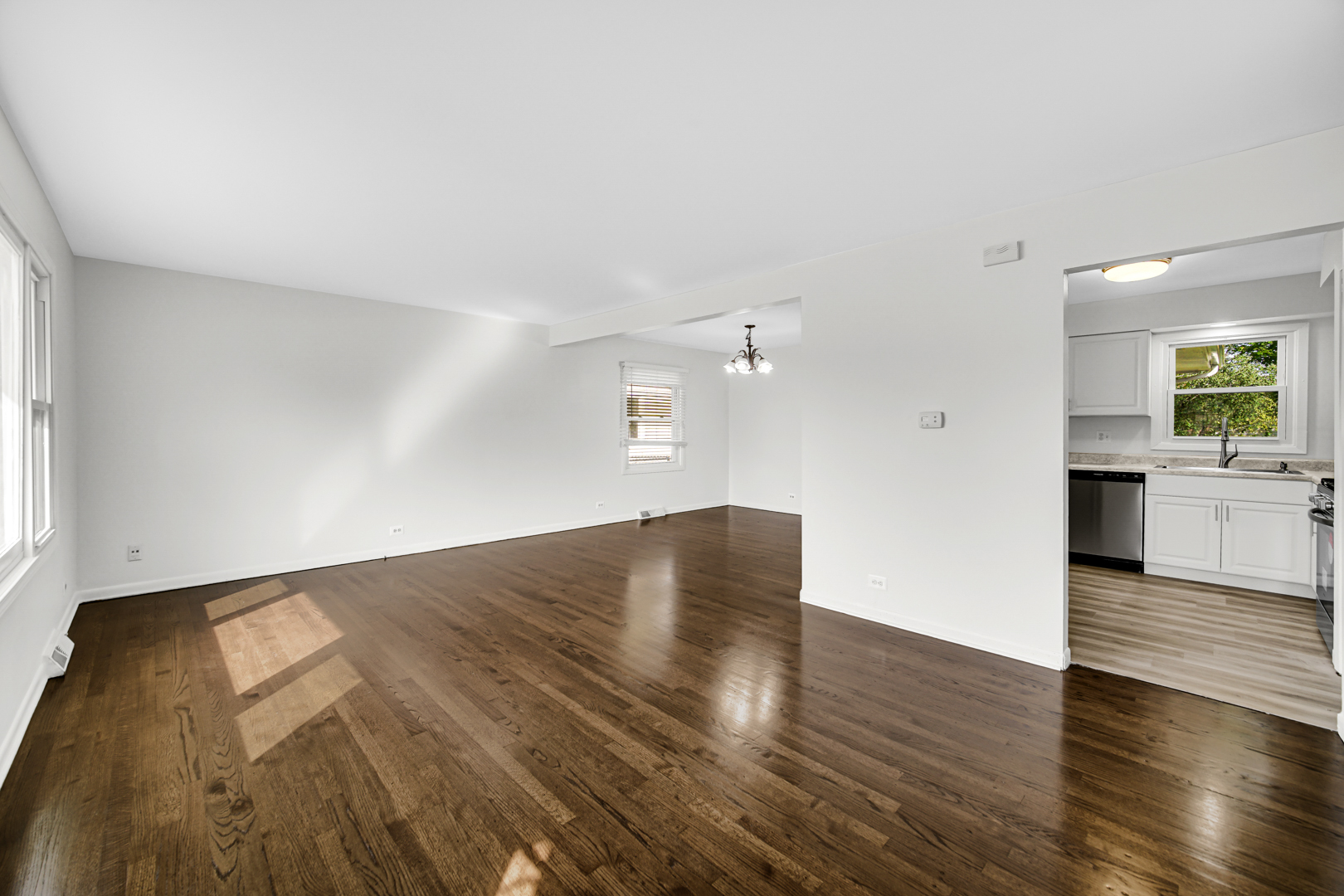 214 Oakleaf Road Lake In The Hills, IL 60156 - Photo 8 of 25 an empty room with wooden floor and windows