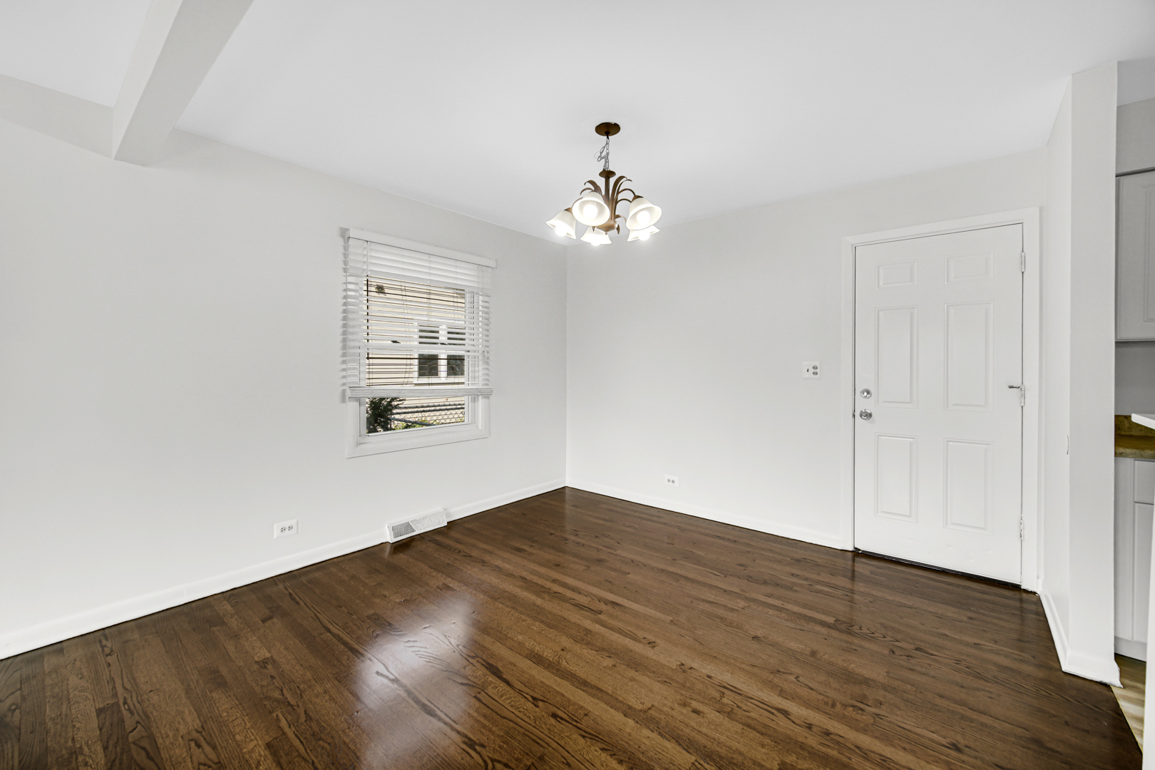 214 Oakleaf Road Lake In The Hills, IL 60156 - Photo 9 of 25 wooden floor in an empty room with a window