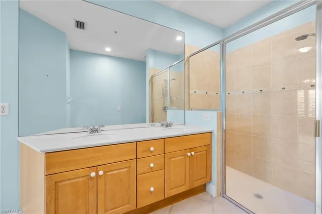 a bathroom with a granite countertop sink mirror and double