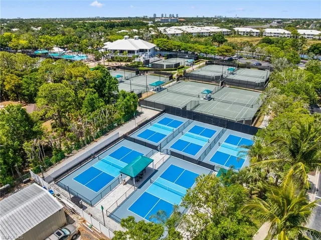 a view of swimming pool with outdoor seating and city view