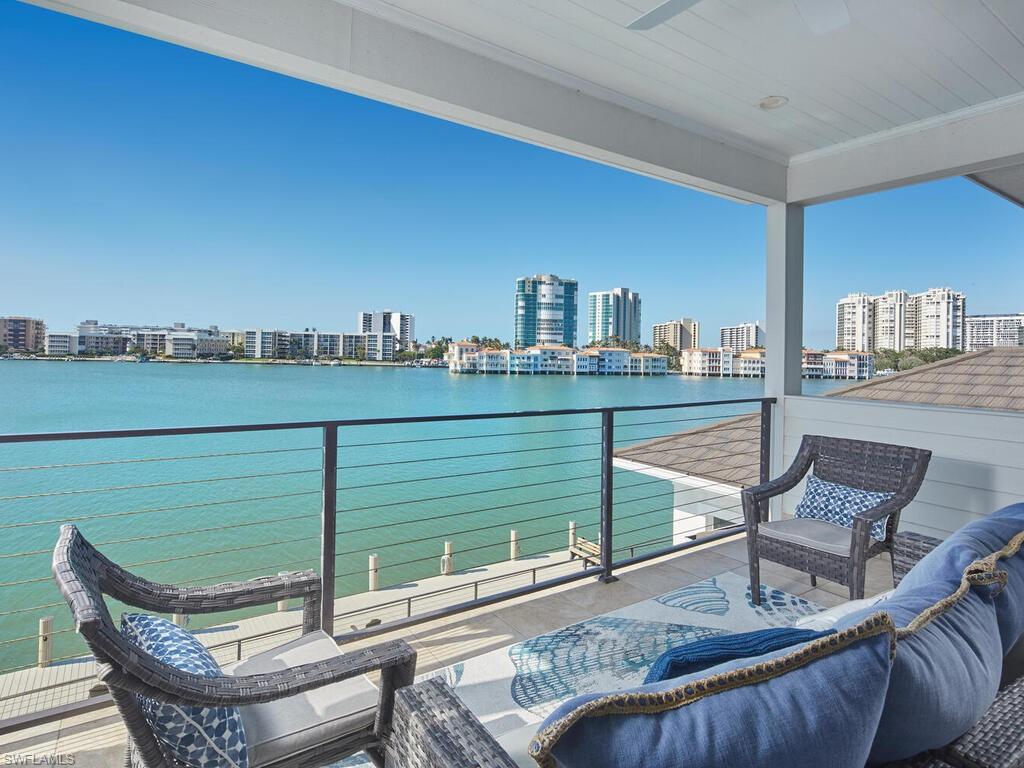 246 Mermaids Bight Naples, FL 34103 - Photo 11 of 16 a view of a chairs in balcony