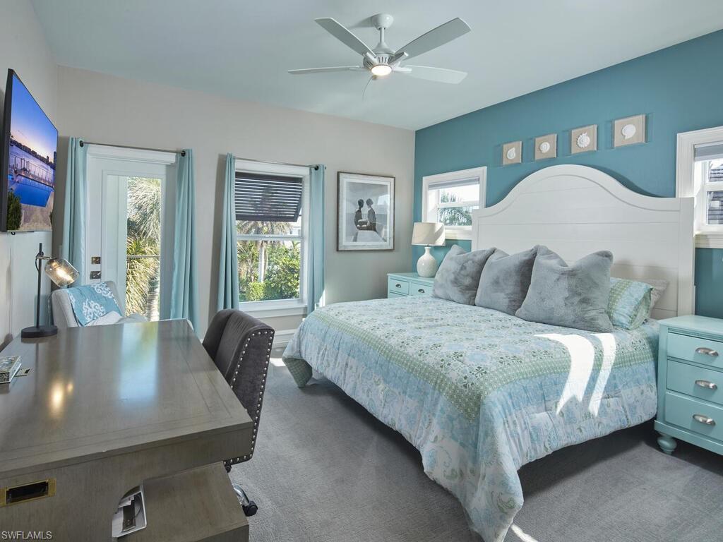 246 Mermaids Bight Naples, FL 34103 - Photo 13 of 16 a bedroom with a bed and window