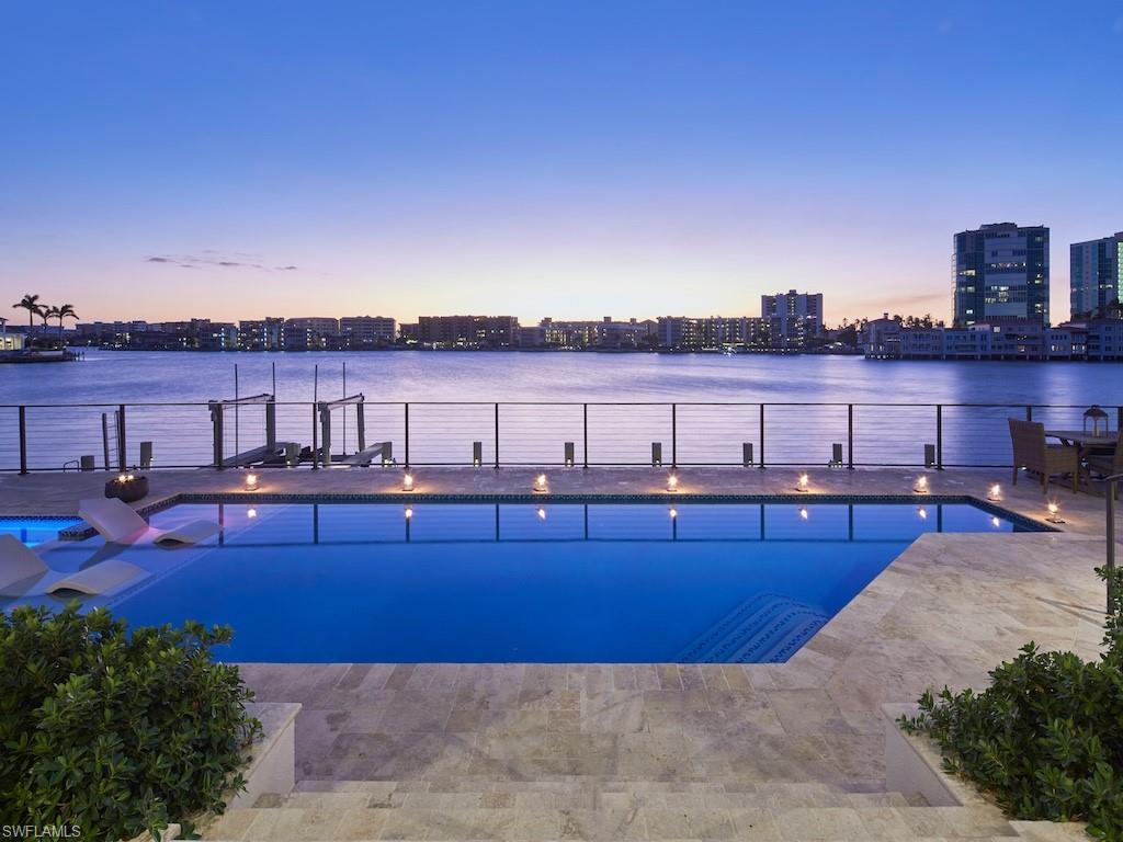 246 Mermaids Bight Naples, FL 34103 - Photo 15 of 16 a view of a swimming pool with a terrace