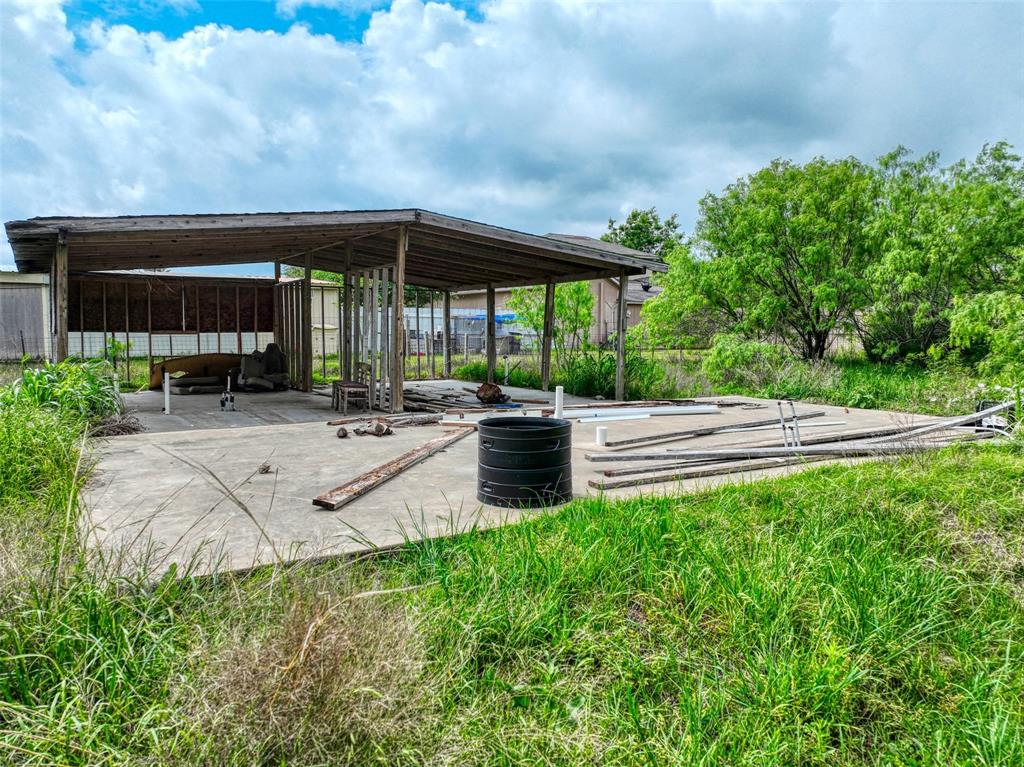 206 185th Rice, TX 75155 - Photo 8 of 23 a backyard of a house with yard table and chairs