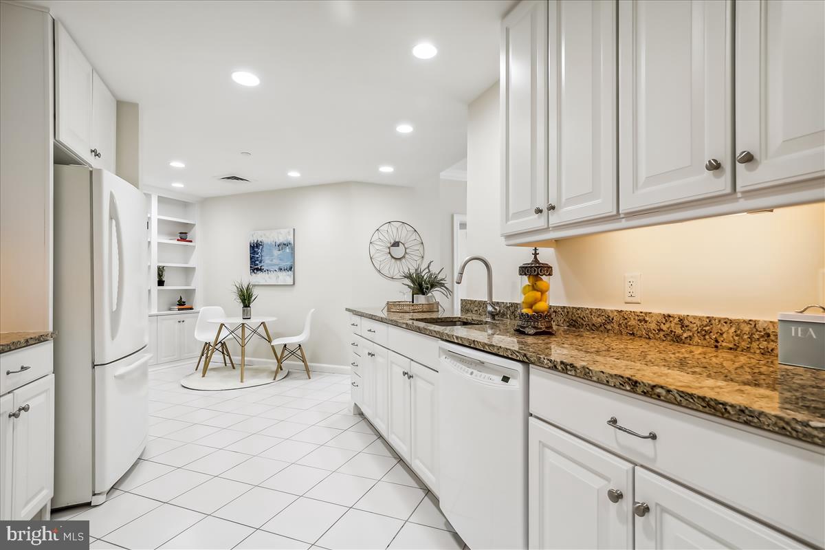 8300 Burdette Road, Unit 507 Bethesda, MD 20817 - Photo 11 of 64 Pristine Kitchen boasts an abundance of cabinets