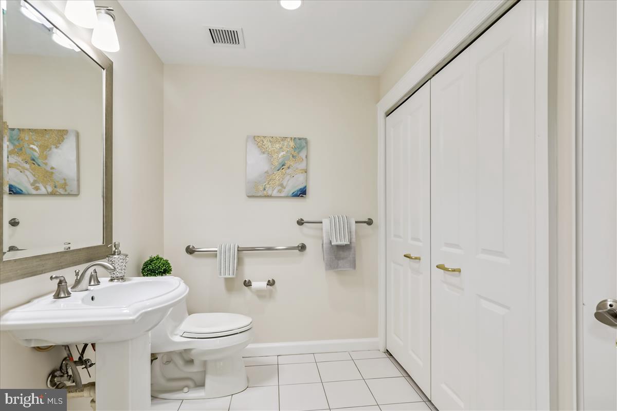 8300 Burdette Road, Unit 507 Bethesda, MD 20817 - Photo 31 of 64 Hall Half Bath. Designer lighting, linen closet