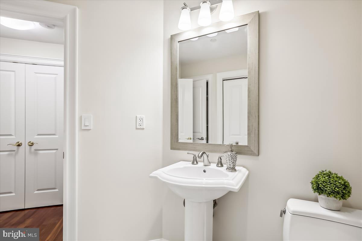 8300 Burdette Road, Unit 507 Bethesda, MD 20817 - Photo 32 of 64 Pedestal sink, tile flooring