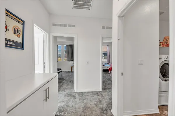 a view of hallway with washer and dryer