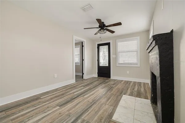 a view of an empty room with a window
