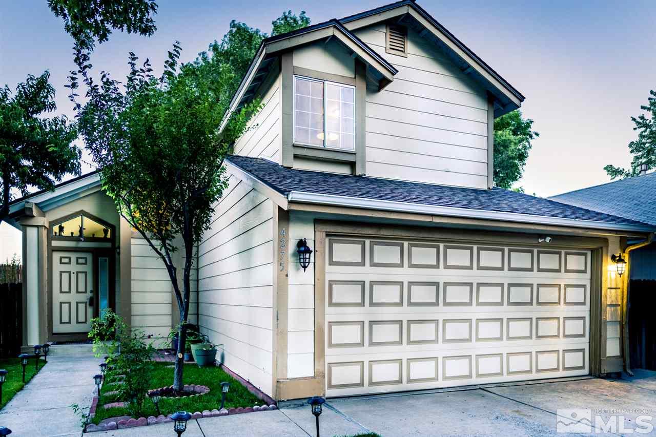 4275 Perro Lane Reno, NV 89502 - Photo 1 of 32 a front view of a house with a garage