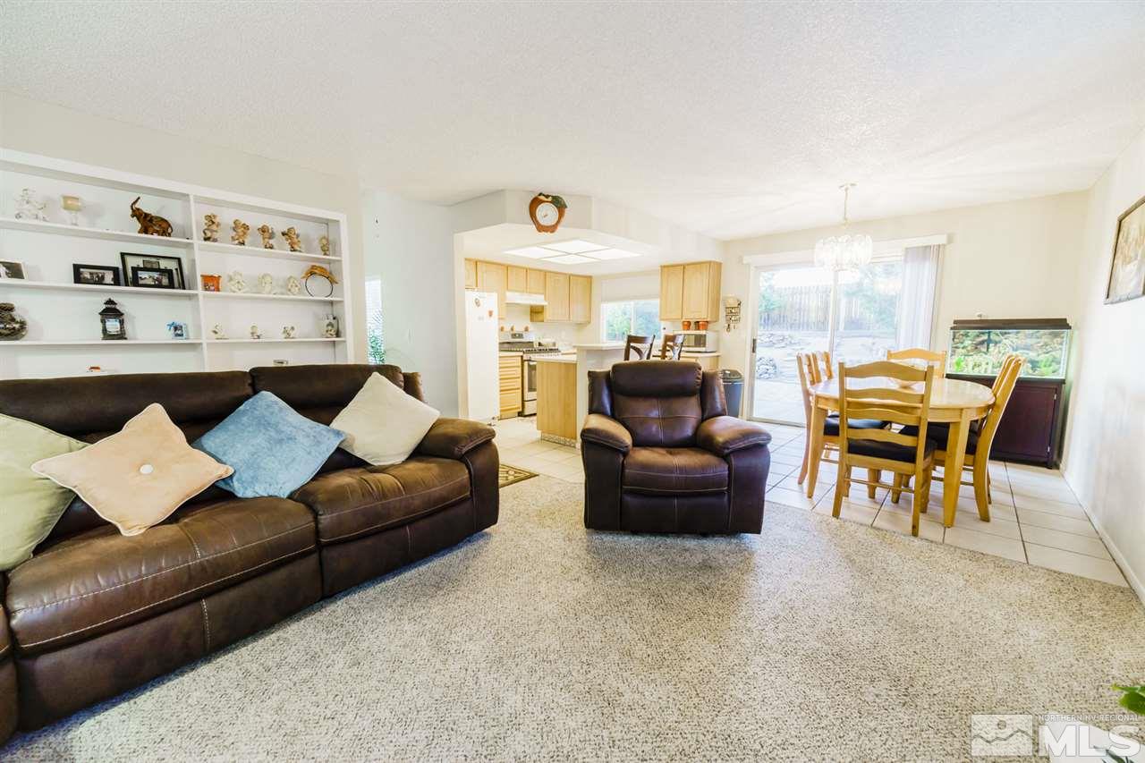 4275 Perro Lane Reno, NV 89502 - Photo 11 of 32 a living room with furniture and a large window